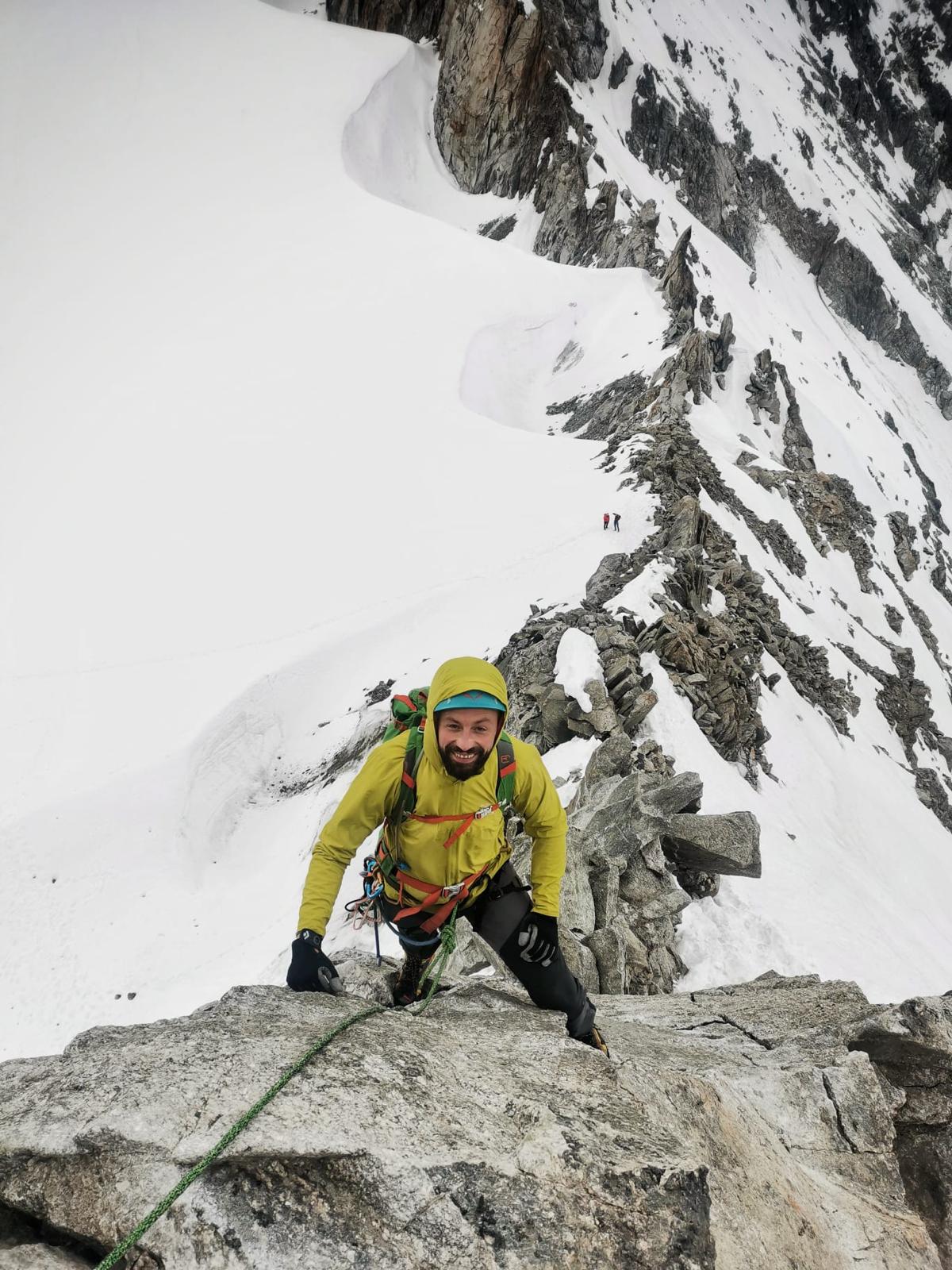 Alpine climbing in snowy mountain terrain